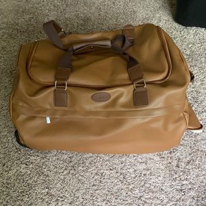 bella russo faux lather duffle travel bag on wheel